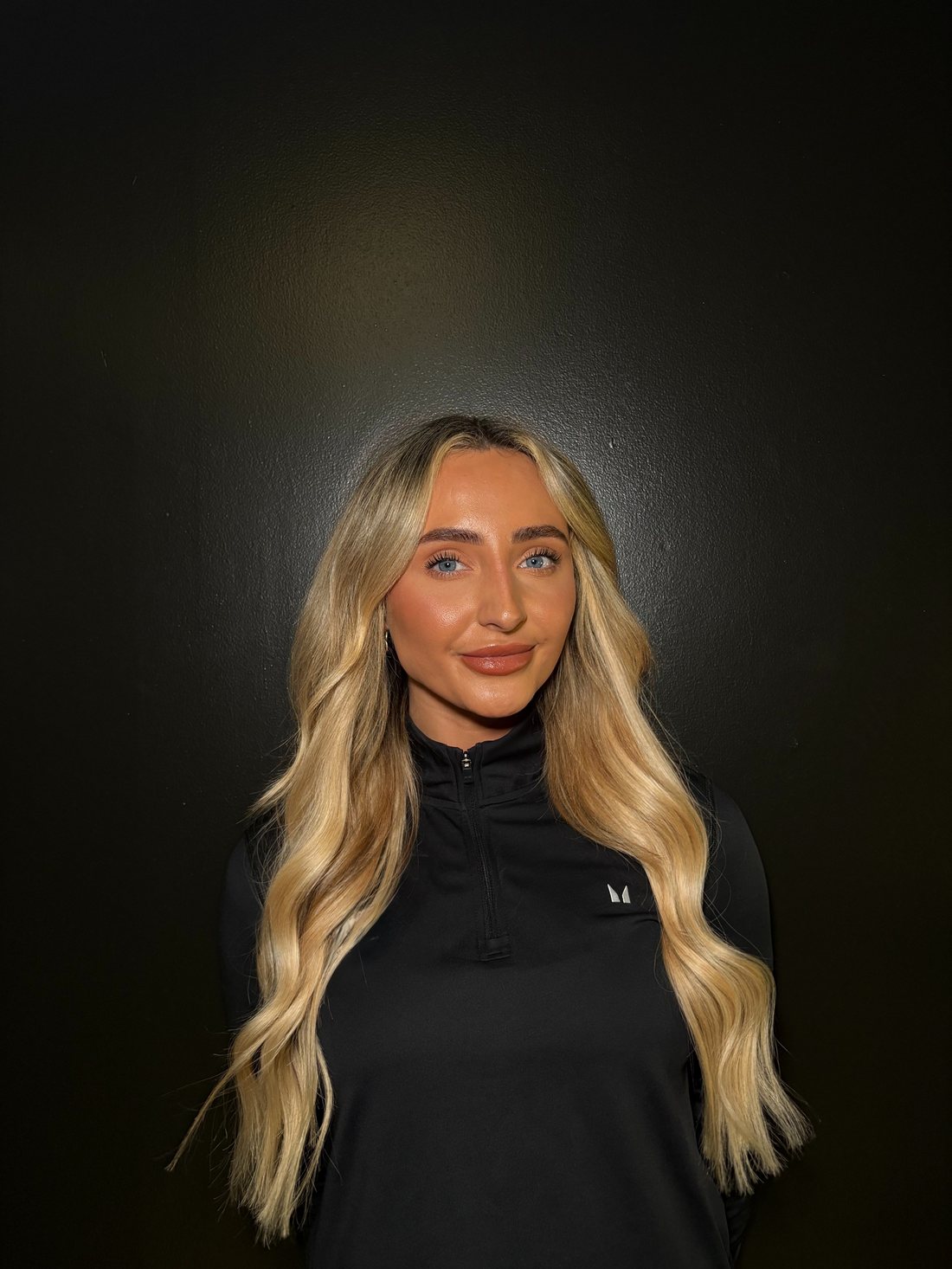 Millie Jade coaching a client in the gym